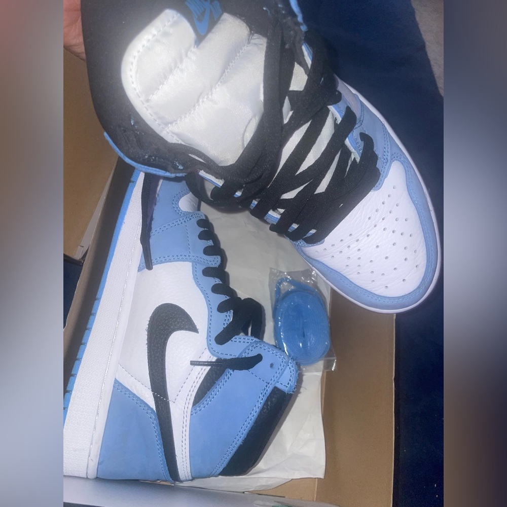 Blue/Black Air Jordan Ones. Barely worn, still have the same packaging and box.